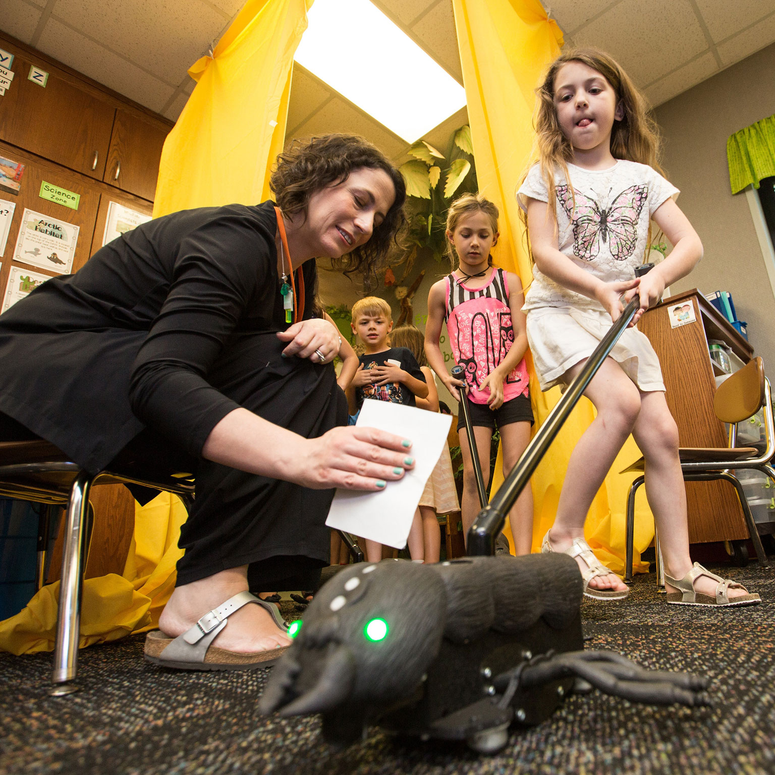 Associate professor Kylie Peppler prepares students at Clear Creek Elementary to use BioSim wearable technology.