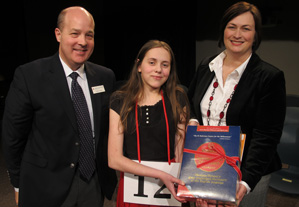 Mary Skirvin, an eighth-grader at Brown County Junior High School, center, at the awards ceremony with Chuck Carney, director of communications and media relations at the IU School of Education, and Teresa White, director of the IU Bee and the Indiana High School Journalism Institute in the IU School of Journalism.