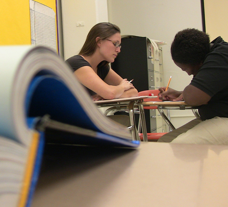 Photo of two students at a desk