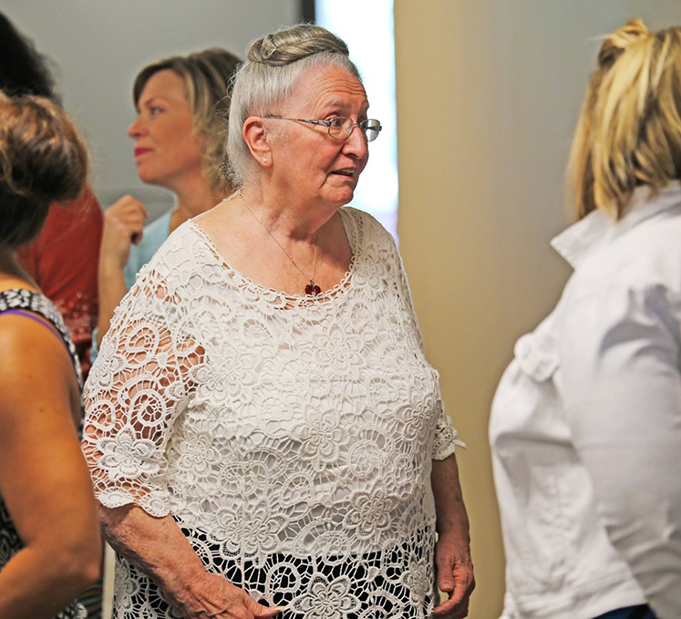 Sandy Strain enjoying time with colleagues at her retirement ceremony