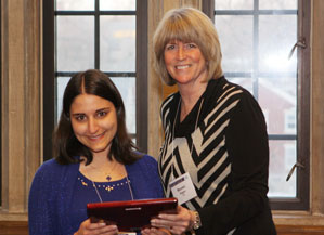 Sophia Bender, left, receives her awayd from Maureen Biggers, assistant dean for diversity and education at the IU School of Informatics and Computing