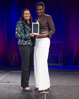 Dionne Cross Francis receives the K-12 Promotion of Education award from the 2014 Women of Color STEM Conference.