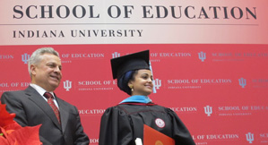 Dean Gerardo Gonzalez (left) with Sara Albadi, who received her master's degree in art education during the IU School of Education convocation ceremony on Dec. 15, 2012.