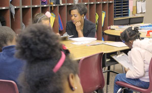 Ewing helping out with students at Snacks Crossing Elementary in Indianapolis.