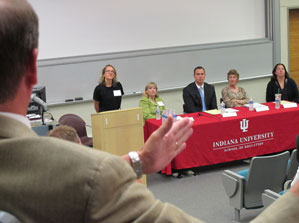 Panelists, including Suzanne Eckes, at podium, and Martha McCarthy, second from right, listen to a question at last year's summer education seminar.