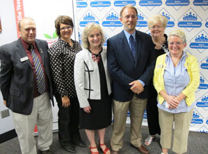 2014 Indiana Teacher of the Year Steven Perkins (center, blue jacket) with the state schools superintendent and past Indiana Teachers of the Year, including IU alumni. (L-R) Mark Weaver, 2004 TOY; Molly Seward, 2005 TOY (B.S., IU School of Education at IUPUI); Ind. State Schools Supt. Glenda Ritz; Perkins; Judy Fraps, TOY 1997 (B.S.'69, IU School of Education); and Louisa LaGrotto, 2006 TOY (M.A. for Teachers '90).