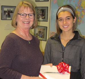 Jill D. Shedd (L), Assistant Dean for Teacher Education and IACTE Executive Secretary, presents Van Pelt with an IPad for winning the IACTE/ISEA video contest.